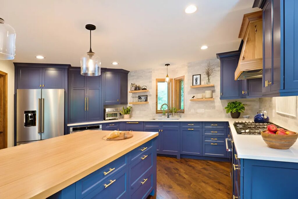Deep navy blue kitchen cabinets with a smooth satin finish by a skilled cabinet painter in Prosper, TX
