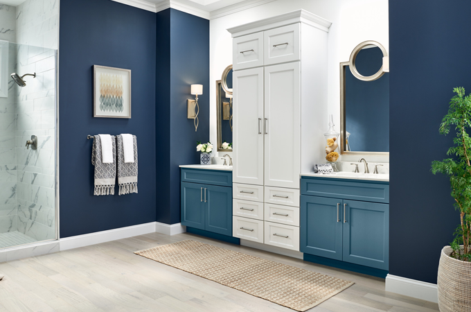 Modern bathroom with blue and crisp white cabinetry with clean satin finishes by a cabinet painter in Allen, TX