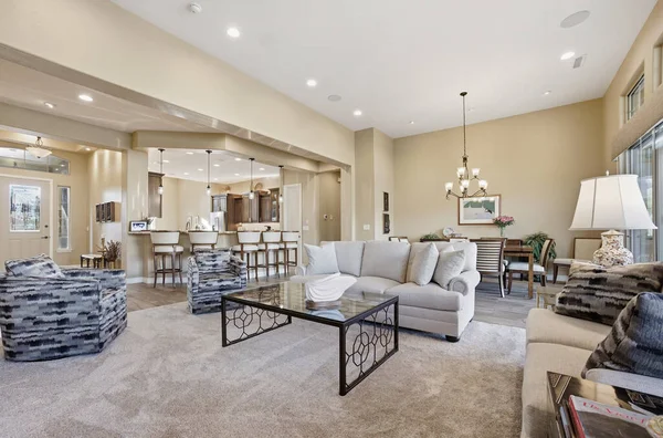Warm beige living room with white trim and neutral finishes by an interior painter in Little Elm, TX